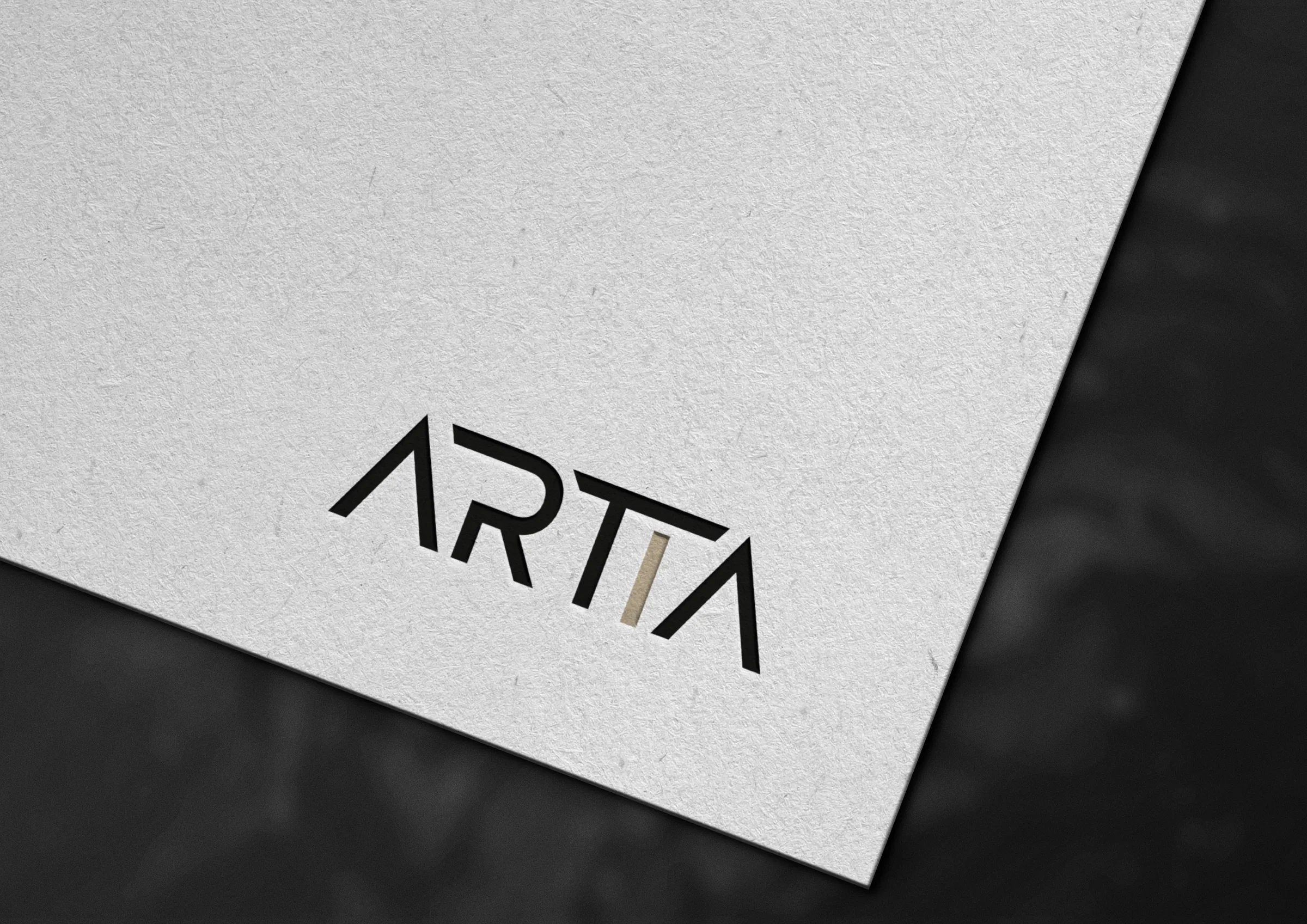 Černobílé logo aplikace Artia na papíře